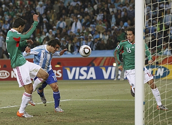 Carlos Tevez  scores Argentina's first goal from an offside position against Mexico in  their Round of 16 match