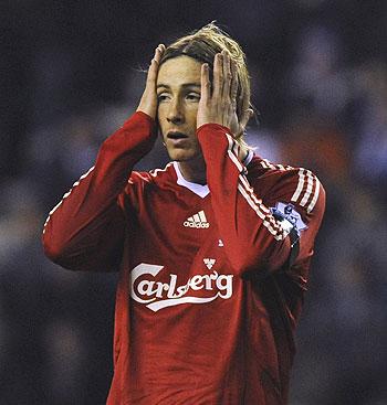 Fernando Torres reacts after missing a goal-scoring opportunity