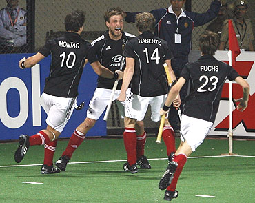 Germany's Moritz Furste (2nd from left) celebrates with team-mates after levelling the scores