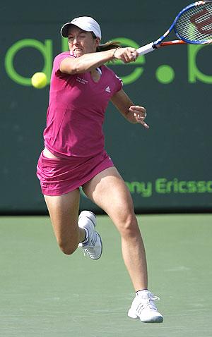 Belgium's Justine Henin hits a return during her match against Jill Craybas in round one of the Sony Ericsson Open tennis tournament match in Key Biscayne, Florida