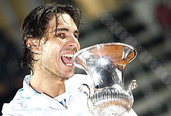 Rafael Nadal poses with the trophy after defeating Ferrer at the Rome Masters