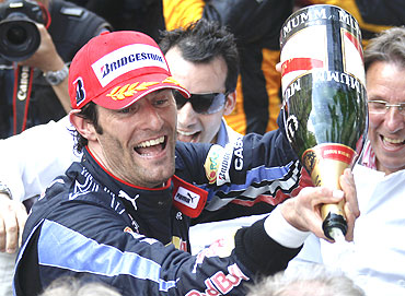 Red Bull's Australian driver Mark Webber sprays champagne after winning the Monaco F1 Grand Prix