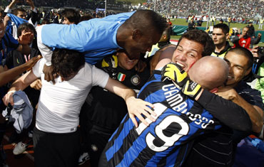 Inter Milan players celebrate after winning the title