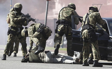 Special task force members take part in a simulated car hijack exercise in Sandton