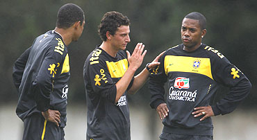 Brazilian soccer players Robinho (right), Elano (centre) and Gilberto Silva attend a practice session