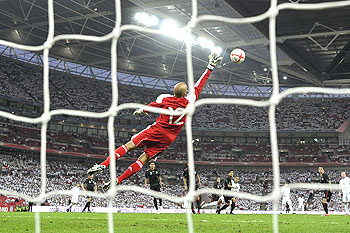 England's Glen Johnson (centre) scores past Mexico's goalkeeper Oscar Perez