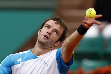 Gabashvili serves during his match