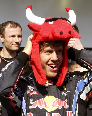 Red Bull driver Sebastian Vettel celebrates after his team won the F1 constructors'  title