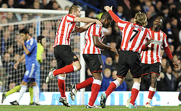 Sunderland's Nedum Onuoha is congratulated by teammates Phil Bardsley and Boudewijn Zenden after scoring against Chelsea on Sunday