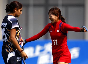 Japan's Kaori Chiba (right) celebrates a goal during the hockey game against India