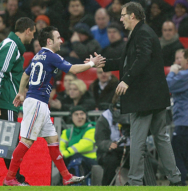 France coach Laurent Blanc congratulates Valbuena as he is substituted against England during their international friendly in London on Thursday
