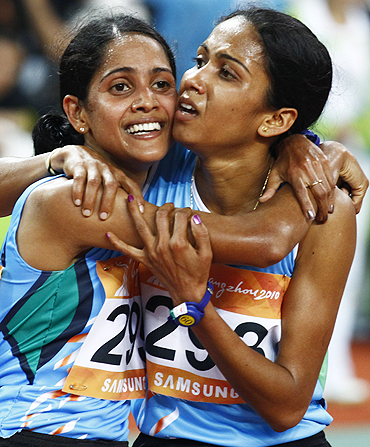 India's Preeja Sreedharan (left) celebrates winning the women's 10,000m final with compatriot and silver medallist Kavita Raut on Sunday