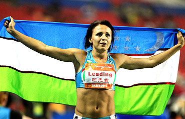 Uzbekistan's Yuliya Tarasova celebrates winning the women's heptathlon at the 16th Asian Games in Guangzhou
