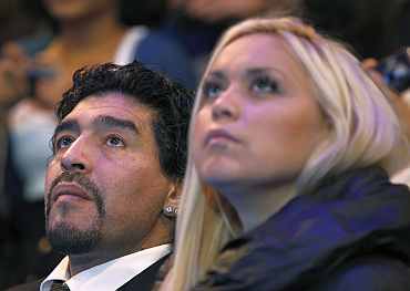 Diego Maradona watches the match at the ATP World Tour Finals in London
