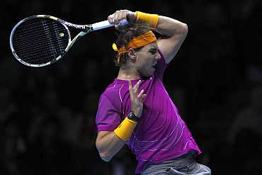 Rafa Nadal returns to Novak Djokovic duirng their match at the ATP World Tour Finals in London