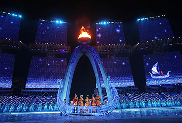 Performers participate at the Asian Games closing ceremony on Sunday