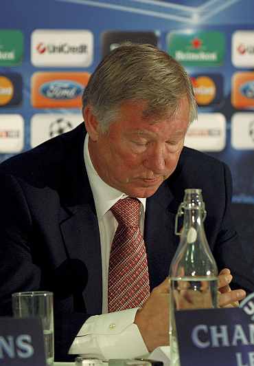 Alex Ferguson reads a statement about the future of Wayne Rooney following a news conference at Old Trafford