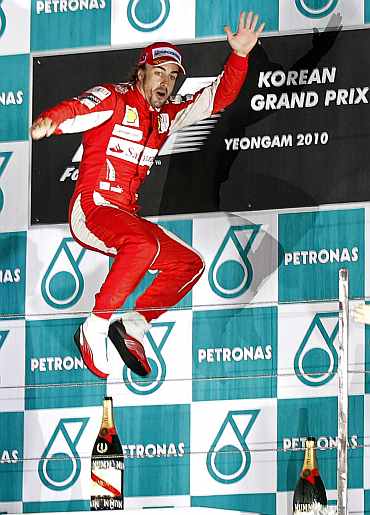 Ferrari's Fernando Alonso celebrates after winning the South Korean F1 Grand Prix