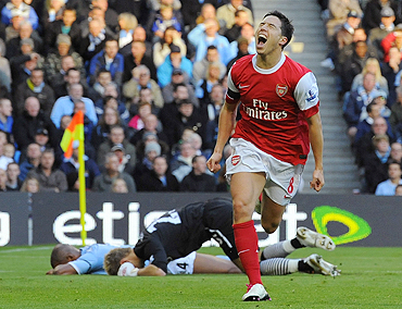 Arsenal's Samir Nasri (right) celebrates after scoring against Manchester City on Sunday