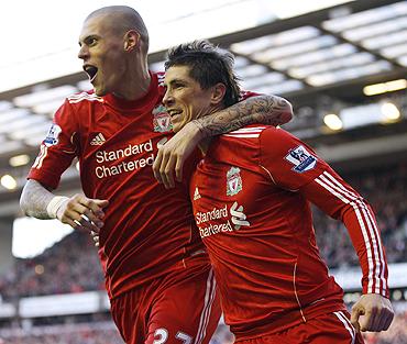 Liverpool's Fernando Torres (right) celebrates with Martin Skrtel (left) after scoring against Blackburn Rovers on Sunday