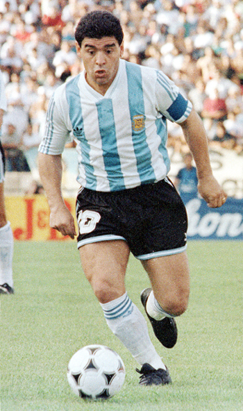 Argentine soccer legend Diego Maradona is seen in this 1993 file photo driving the ball during a friendly against Brazil