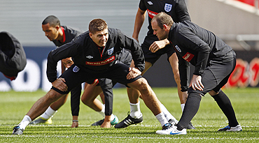 Steven Gerrard and Wayne Rooney attend a team training camp at Wembley on Thursday
