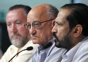 Commonwealth Games Federation President Michael Fennell (centre) CWG Federation CEO Mike Hooper (left) and CWG Organising Committee chairman Suresh Kalmadi at a news conference in New Delhi