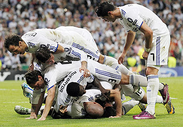 Real Madrid's players celebrate after Angel Di Maria's goal against Tottenham Hotspur