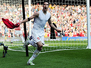 Arsenal's Robin van Persie celebrates after scoring a penalty against Liverpool