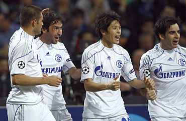 Schalke players celebrate after scoring a goal
