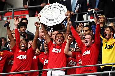 Man United players celebrate after winning the Community Shield