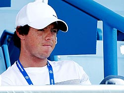 Golfer Rory McIlroy watches friend Caroline Wozniacki during her match against Christina McHale