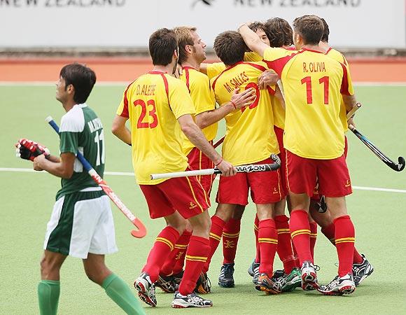 Spanish players celebrate after scoring against Pakistan during their Champions Trophy match in Auckland on Monday