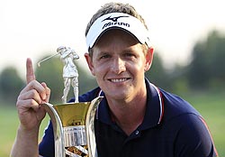 Luke Donald of England poses with the Race to Dubai trophy