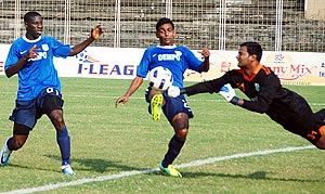 Dempo players in action with Sporting players