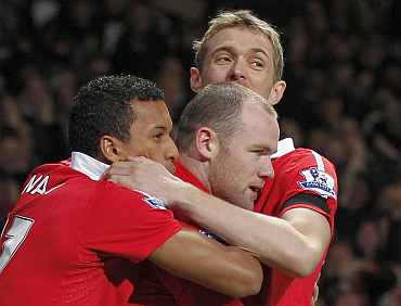 Wayne Rooney celebrates after scoring against Aston Villa on Tuesday