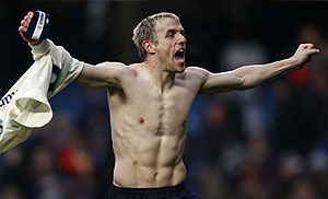Everton's Phil Neville celebrates scoring the winning penalty against Chelsea during their FA Cup match at Stamford Bridge on Saturday