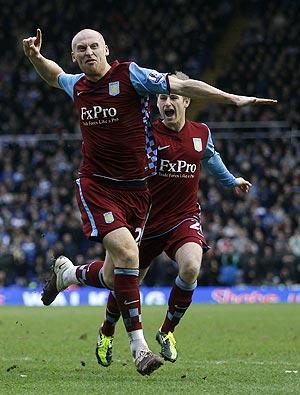 Aston Villa's James Collins (left) celebrates his goal against Birmingham City with Barry Bannan on Sunday