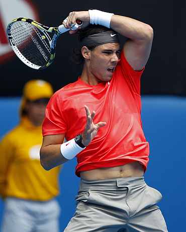 Rafa Nadal returns during his match against Ryan Sweeting during the Australian Open