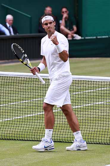 Rafa Nadal reacts after winning the third set during his final match against Novak Djokovic