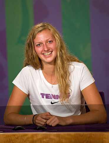 Petra Kvitova attends a press conference after winning the Women's final against Maria Sharapova on Day Twelve of the Wimbledon Lawn Tennis Championships