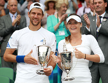Jurgen Melzer of Austria and Iveta Benesova of the Czech Republic after winning their Wimbledon mixed doubles final on Sunday