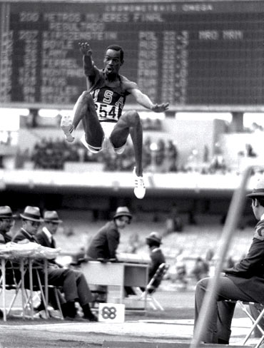 Bob Beamon of the USA breaking the Long Jump World Record during the 1968 Olympic Games in Mexico City, Mexico. Beamon long jumped 8.9 m (29 ft 2 1/2 in), winning the gold medal and setting a new world record