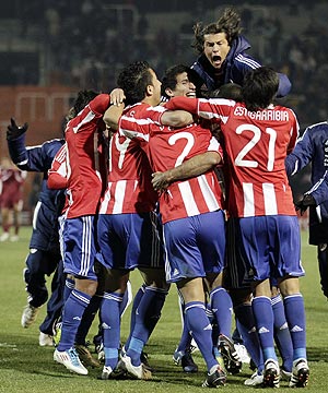 Paraguay's players celebrate after winning their semi-final soccer match against Venezuela
