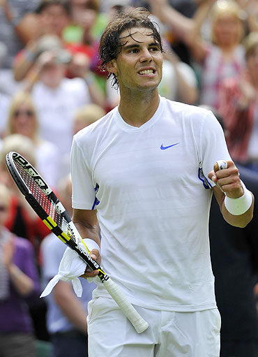 Rafael Nadal reacts after defeating Michael Russell