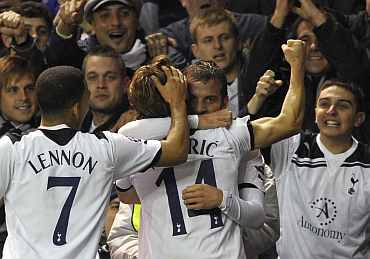 Tottenham players celebrate after scoring a goal