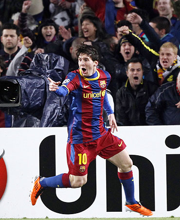 Barcelona's Lionel Messi celebrates after scoring the first goal against Arsenal on Wednesday