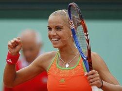 Arantxa Rus of the Netherlands reacts after beating Clijsters