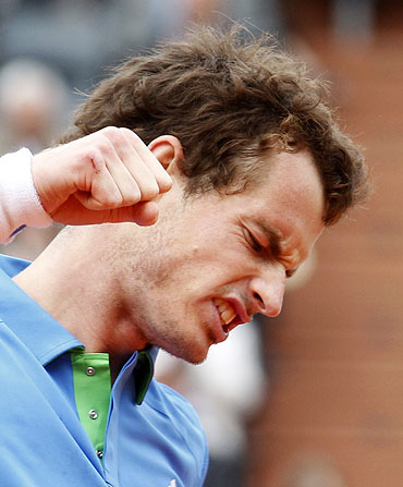 Britain's Andy Murray reacts after beating Italy's Simone Bolelli
