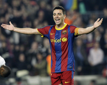 Barcelona's Xavi celebrates after scoring a goal